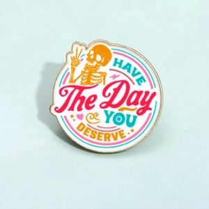 Colorful "Have The Day You Deserve" Skeleton pin